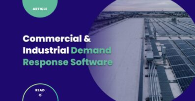 Aerial view of an industrial campus with rooftop solar arrays representing commercial and industrial demand response software integration with on-site distributed energy resources