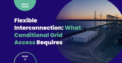 A distribution substation and overhead feeder lines beside a utility-scale solar array at dusk, illustrating flexible interconnection and conditional grid access for renewable energy projects.